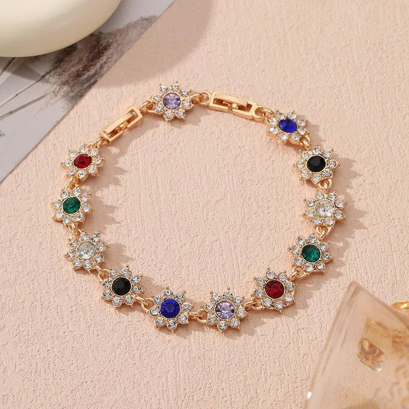 Women's zinc alloy bracelet with flower design and electroplated finish in gold and silver colour options
