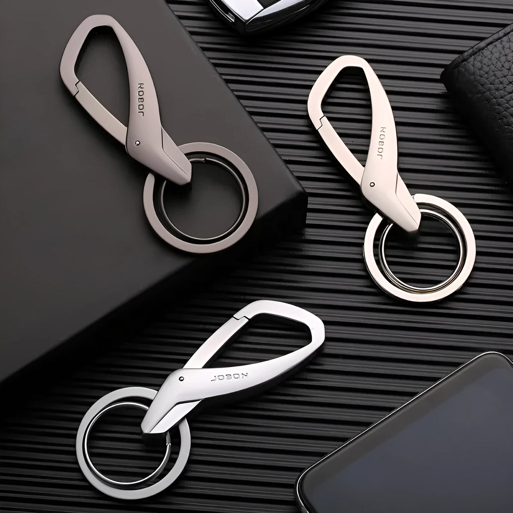 Zinc alloy double ring keychain in black, chrome, or nickel colour, shown with dimensions 8.3 by 3.5 cm.