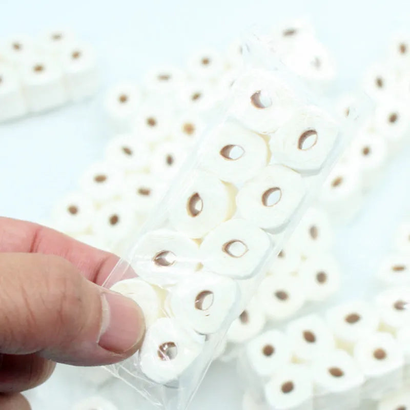Miniature paper model of a tissue roll for children's play, measuring 30mm by 15mm by 80mm.