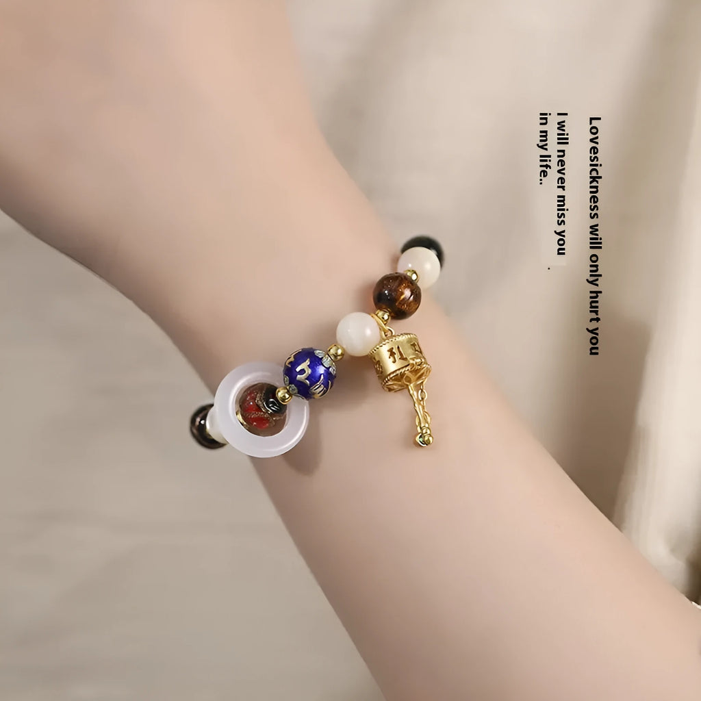 Hand-woven fragrant grey coloured glaze bracelet with sunstone and white lip shell beads