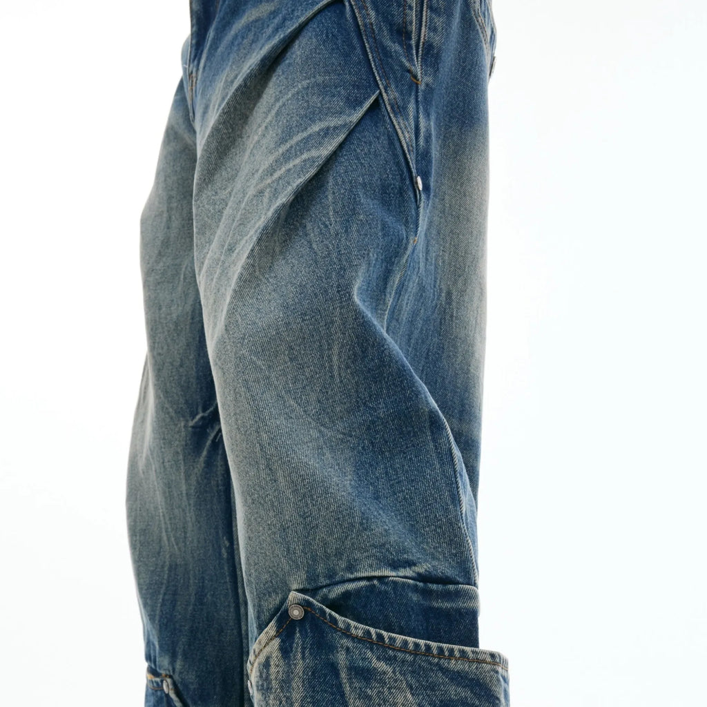 Men's Verdant blue loose-fit retro jeans with a faded burst pattern and curved knife leg design.