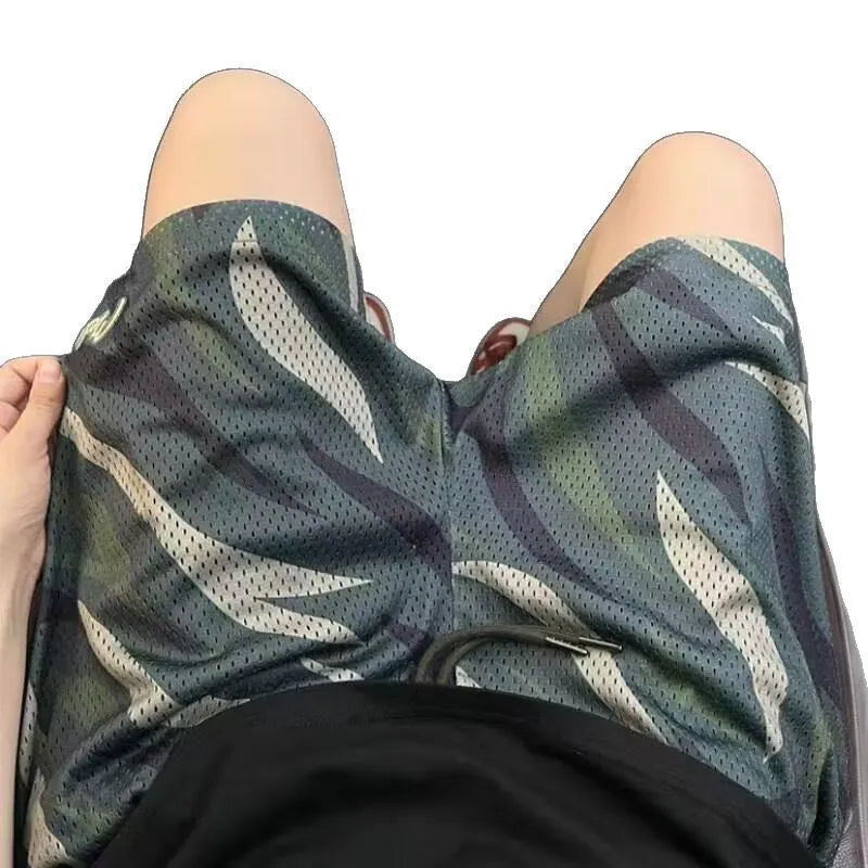 Men's camouflage mesh shorts with straight leg design and cotton blend fabric