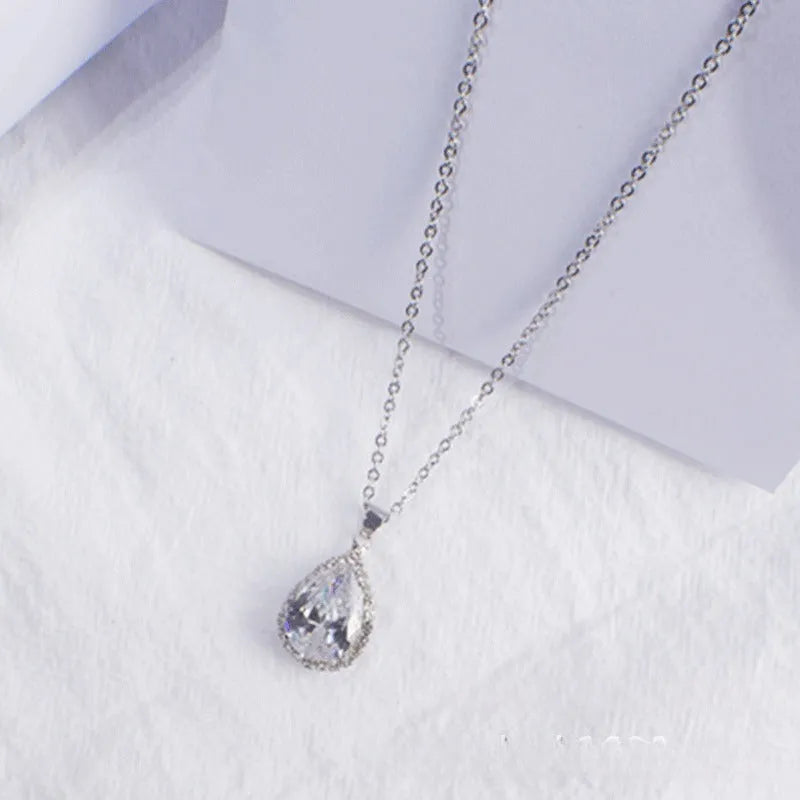Geometric drop shape alloy necklace with rhinestone accents in rose gold pink finish
