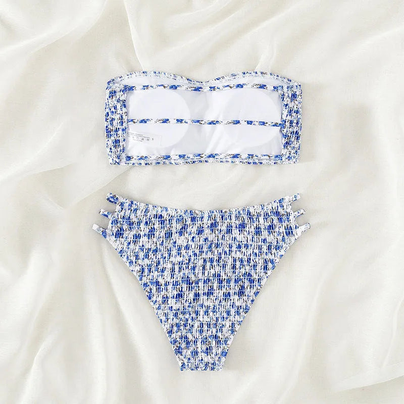 Women's floral strapless swimsuit with split back and high-waist briefs on white background.