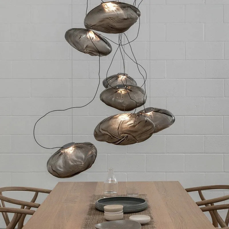 Modern fabric chandelier with glass shade in clear, amber, or smoke grey colour options.