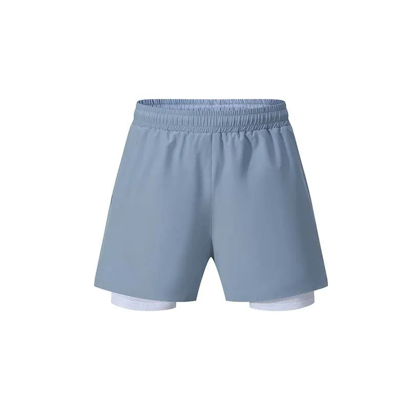 Men's black double-layer running shorts with inner liner on a man running outdoors.