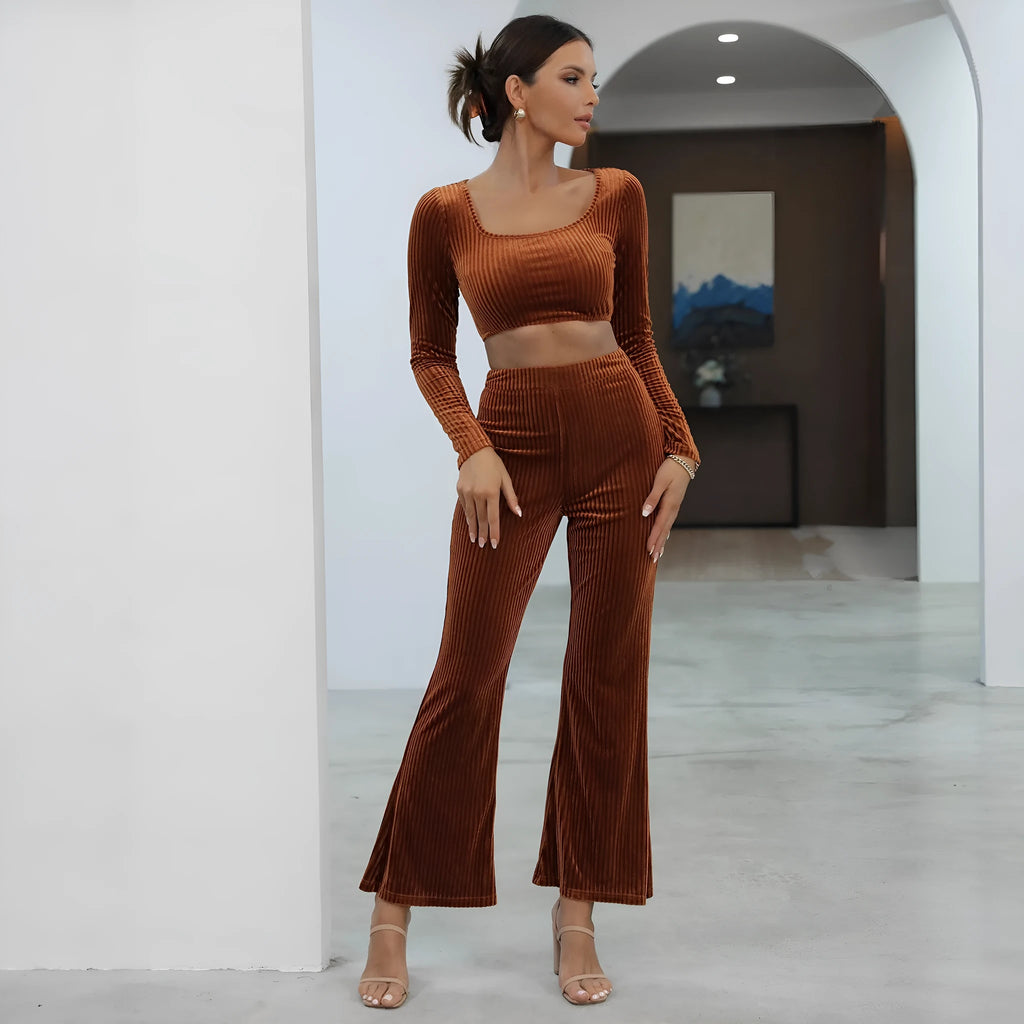 Caramel coloured long sleeve sweater and matching trousers casual set laid flat.