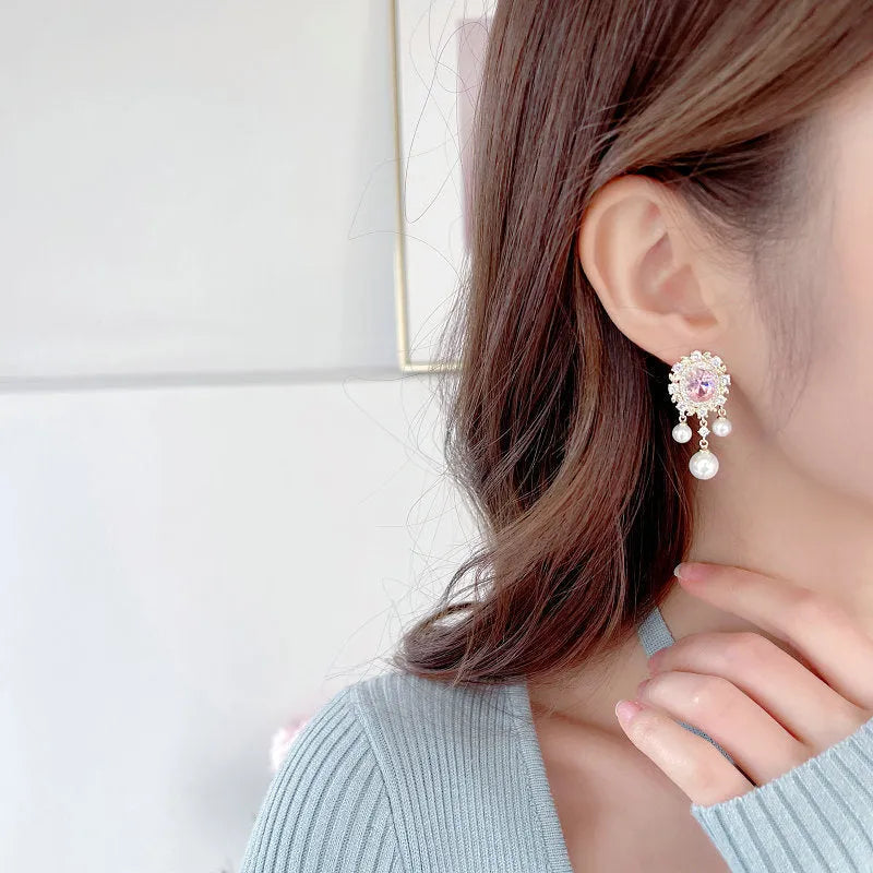 Oval geometric tassel earrings with zircon inlaid pearls in light purple, pink, or white.
