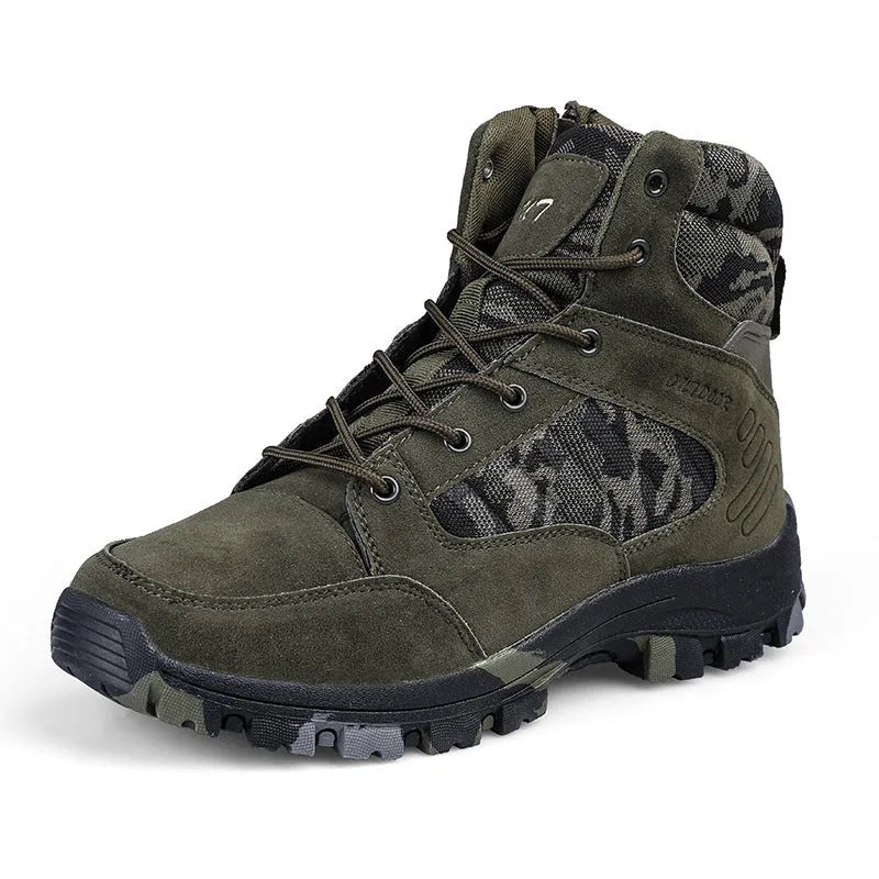 Men's black high-top hiking shoe with metal detail on a rugged outdoor surface