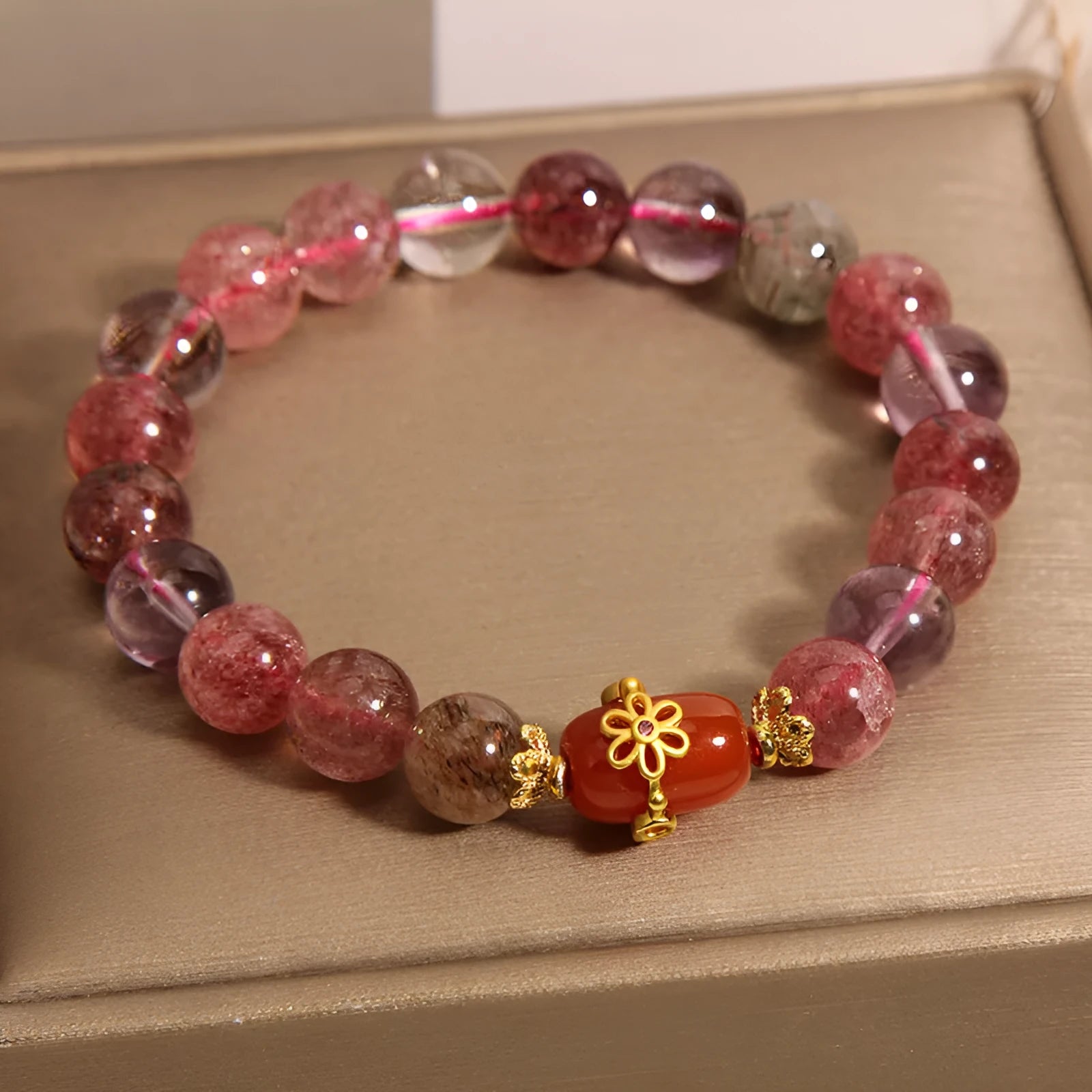 Natural Super Seven crystal bracelet with white crystal and red agate stones in cartoon-style design
