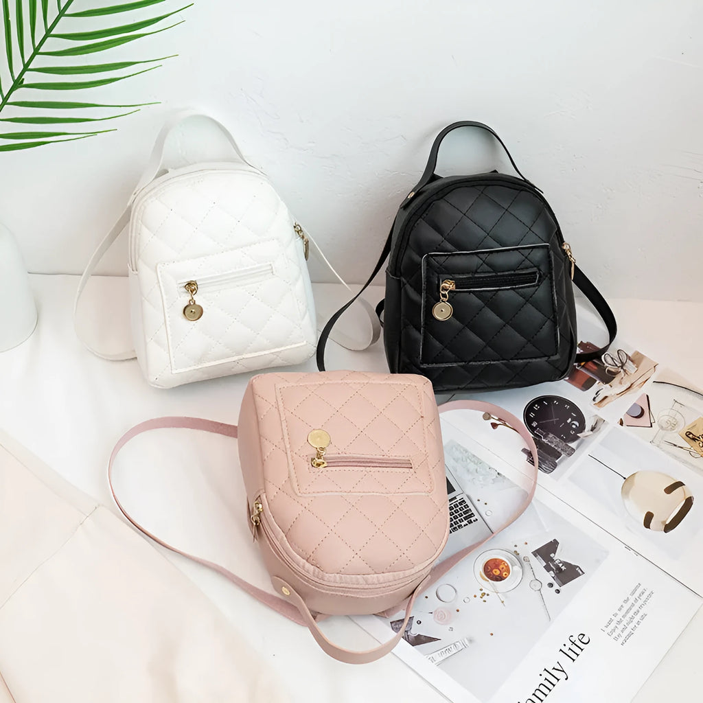 Girls' hard square PU backpack with embroidery in pink, showing front sandwich pocket and carry handle.