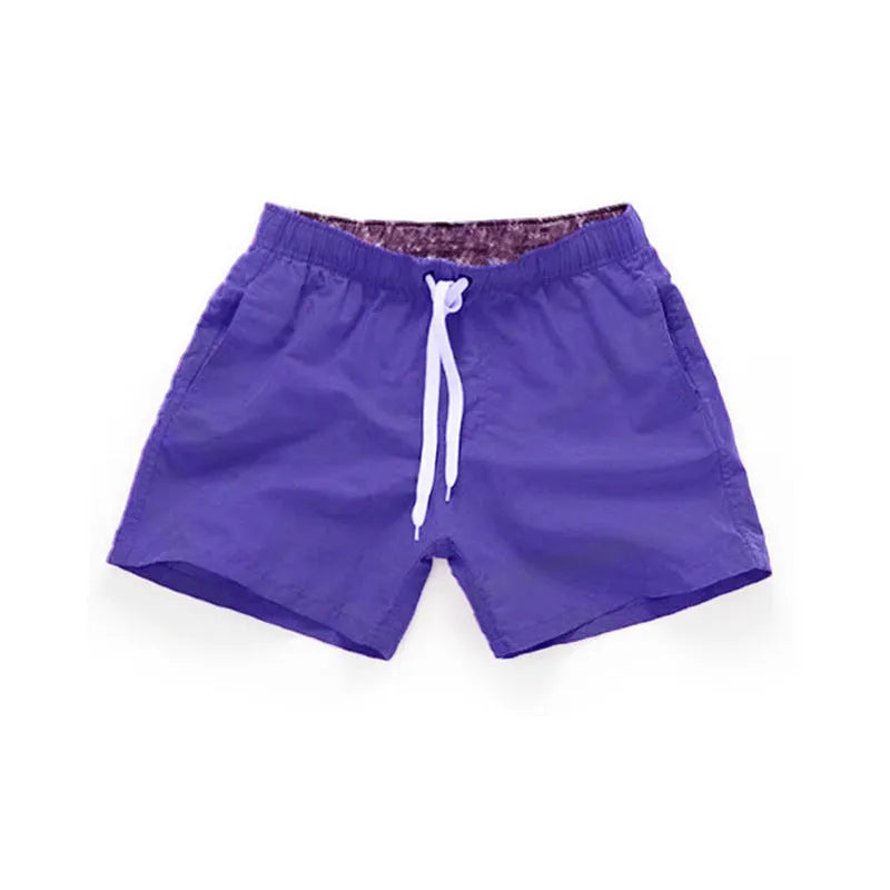 Men's plus size polyester beach shorts in black, showing straight leg opening.