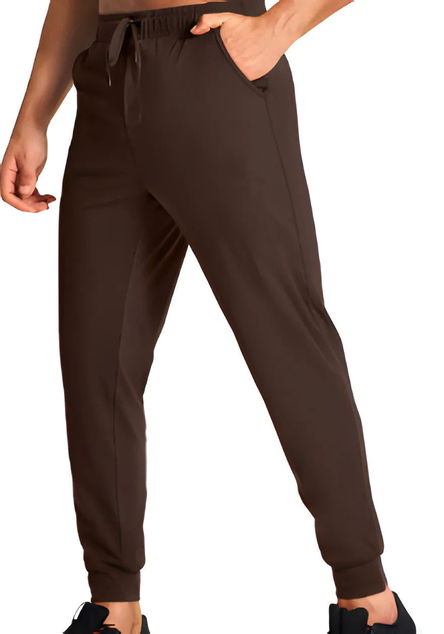 Men's loose fit solid colour casual polyester trousers on a hanger.