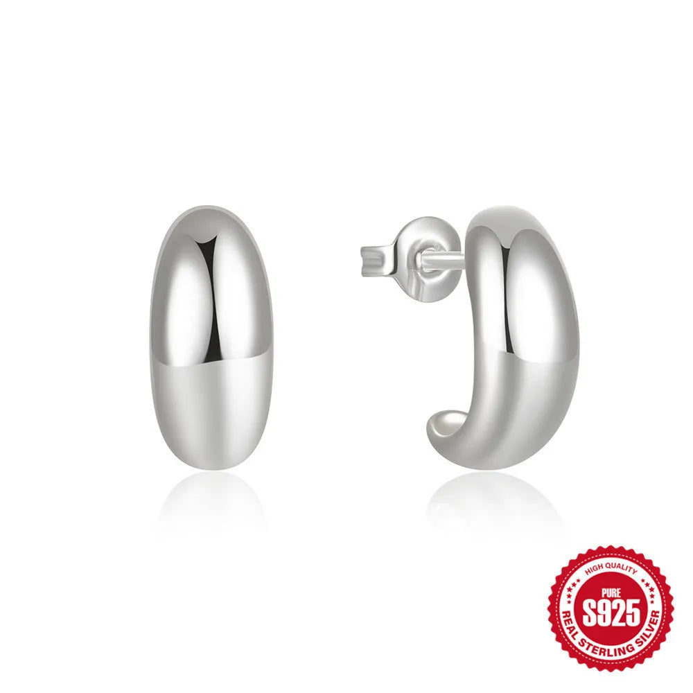 Sterling silver C-ring stud earrings with electroplated gold finish geometric design