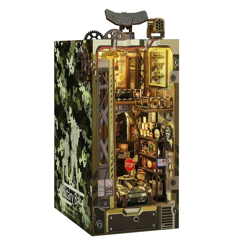 Wooden building block kit for a cottage book stand in military base colour, assembled on a desk
