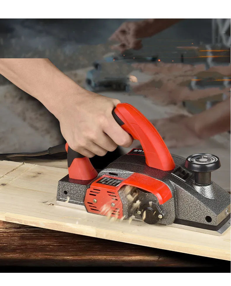 Red electric wood planer with aluminium shell, 82mm planing width