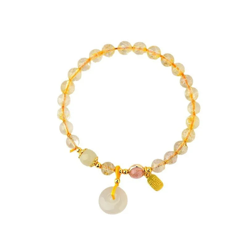 Gold rutilated quartz crystal bracelet with safety buckle and geometric blessing card pendant