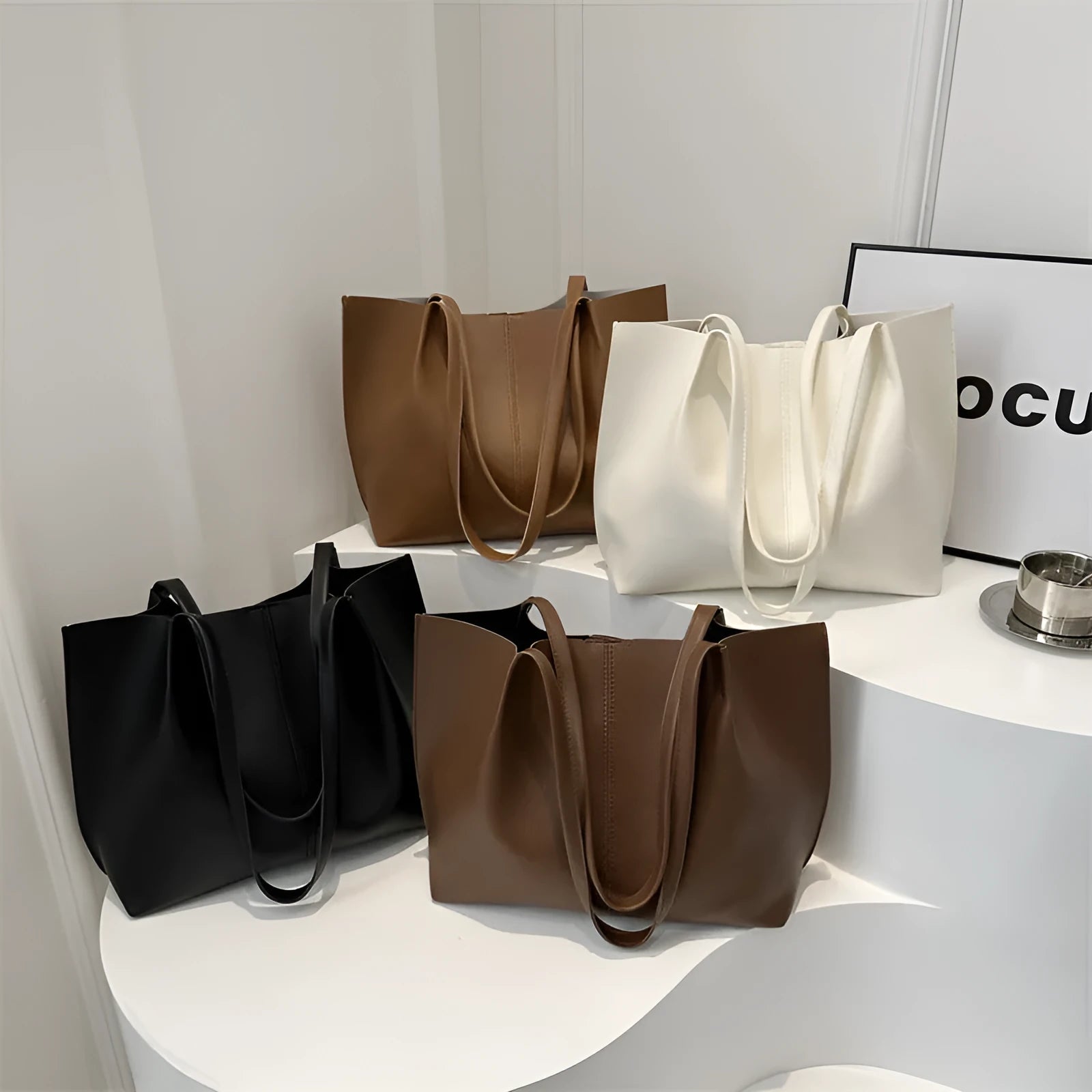 Black PU leather bucket messenger bag with stitching and open outer pocket, double straps, medium hardness