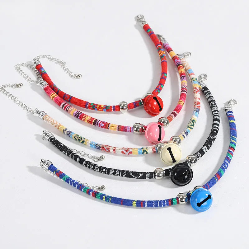 Ethnic style pet collar with bell in multiple colours showing adjustable fastening