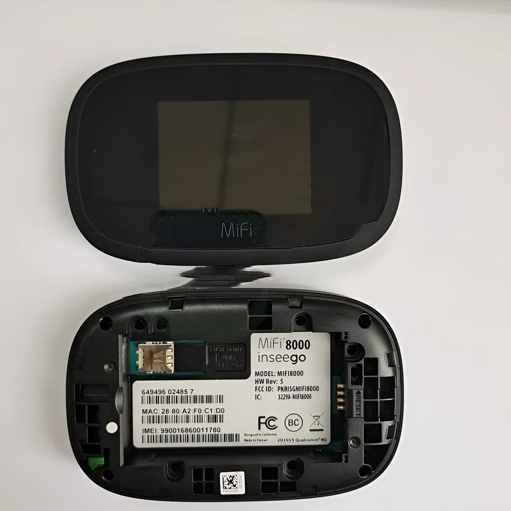 Black mifi8000 4G portable wireless router showing its compact size next to a data cable.