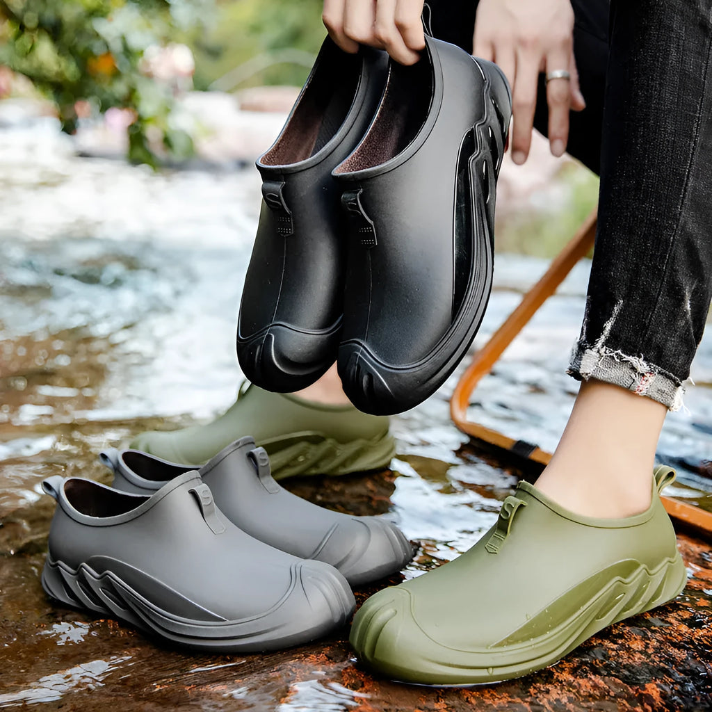 Men's short black plastic rain boots shown in a casual setting