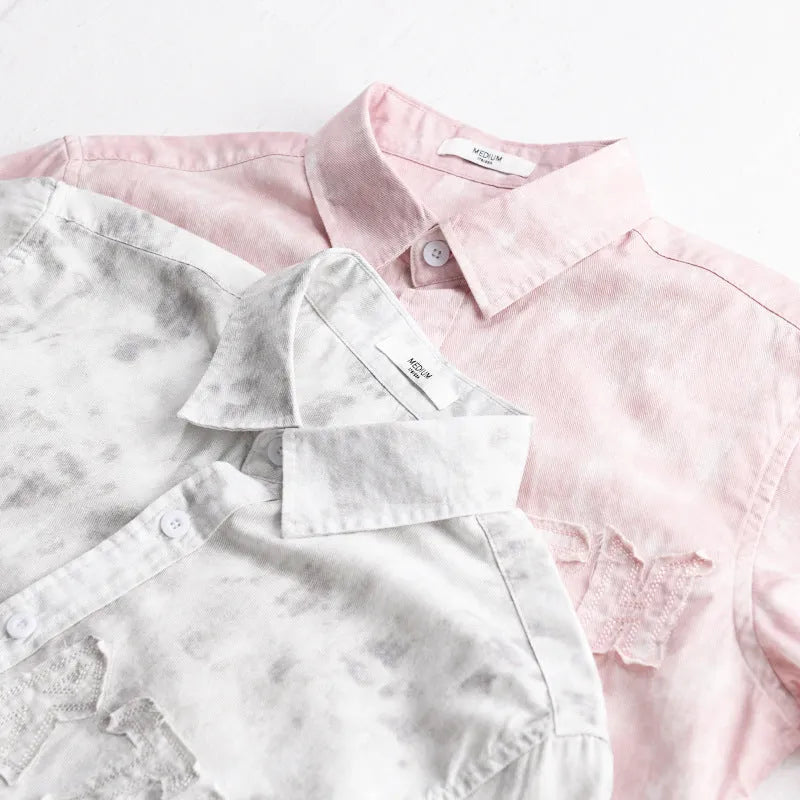 Men's light pink hanging dyed printed short sleeve cotton cardigan with loose fit on hanger