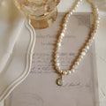 Geometric vintage pearl alloy necklace on adjustable chain from 21cm to 50cm.