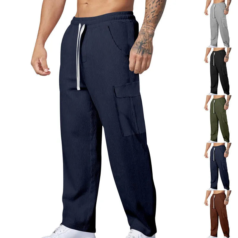 Men's corduroy cargo trousers in loose-fitting wide-leg style with drawstring waist