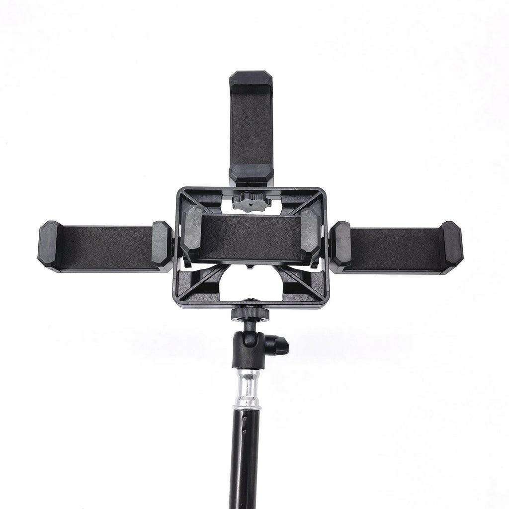 Black mobile phone tripod extended to 1.1m on a desk showing metal legs and phone mount