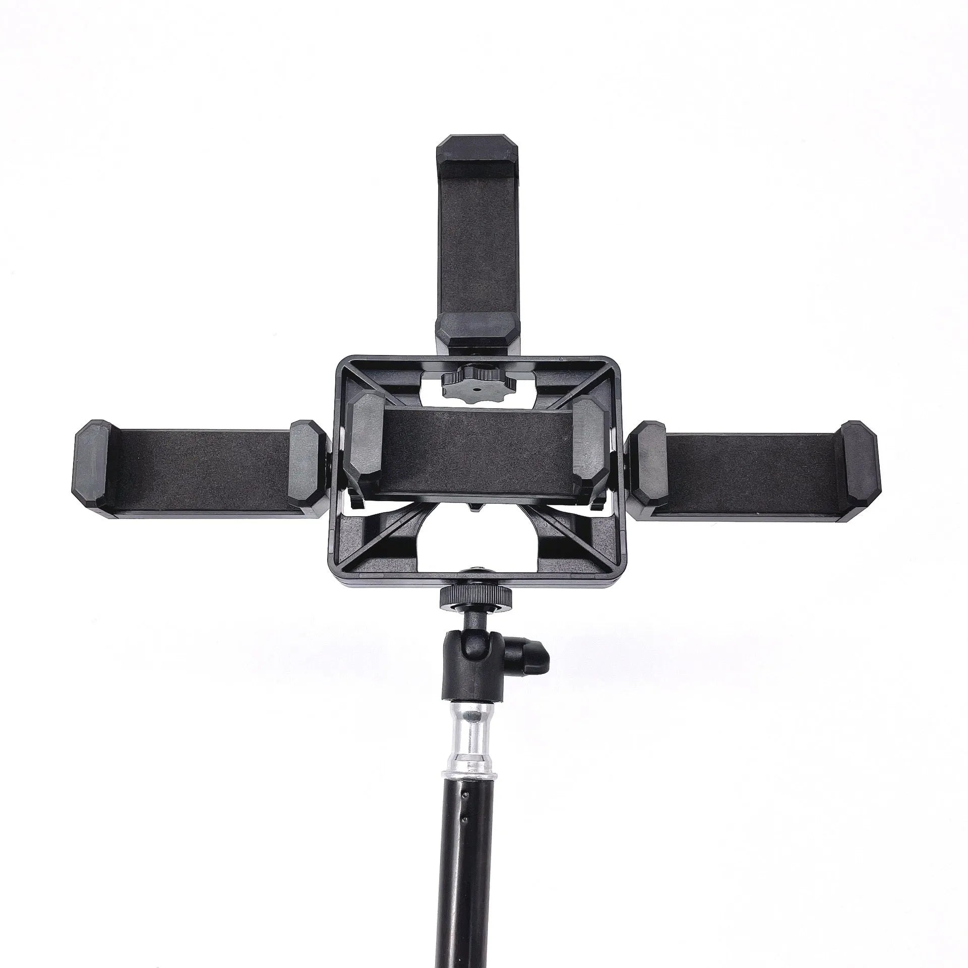 Black mobile phone tripod extended to 1.1m on a desk showing metal legs and phone mount