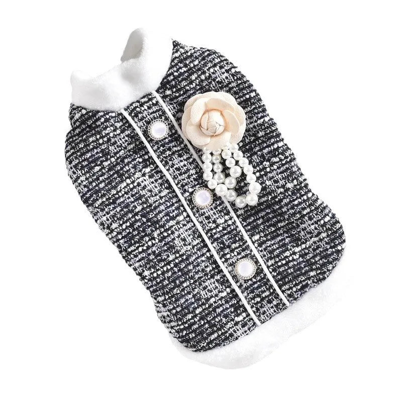Black PU sausage jacket for cats shown on small feline model