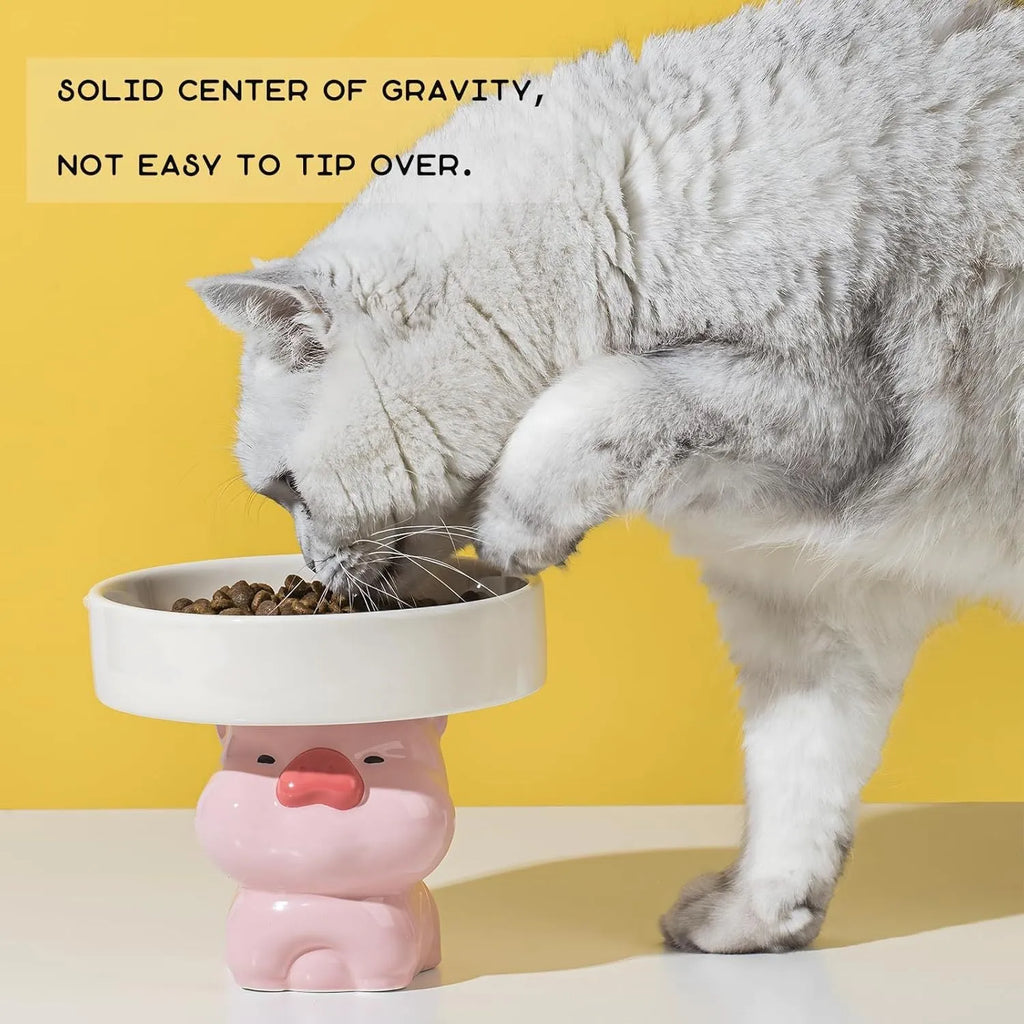 Ceramic raised cat bowl with animal design, showing elevated height and wide feeding opening