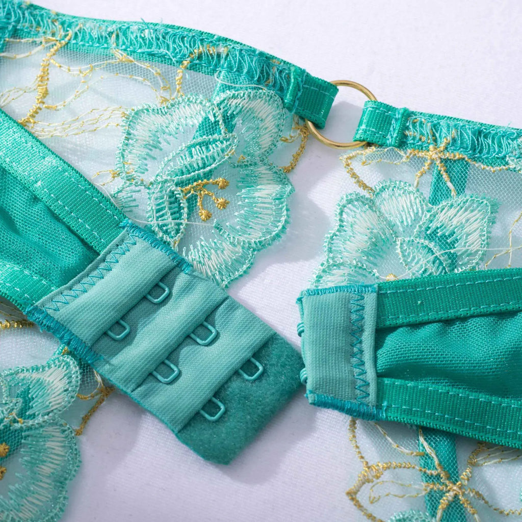 Light green women's bra set with embroidery detailing showing front view of three-point style construction
