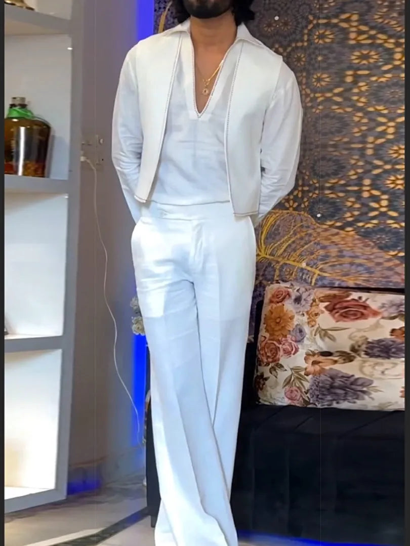 White three-piece outfit set showing V-neck shirt, sleeveless vest, and trousers laid flat