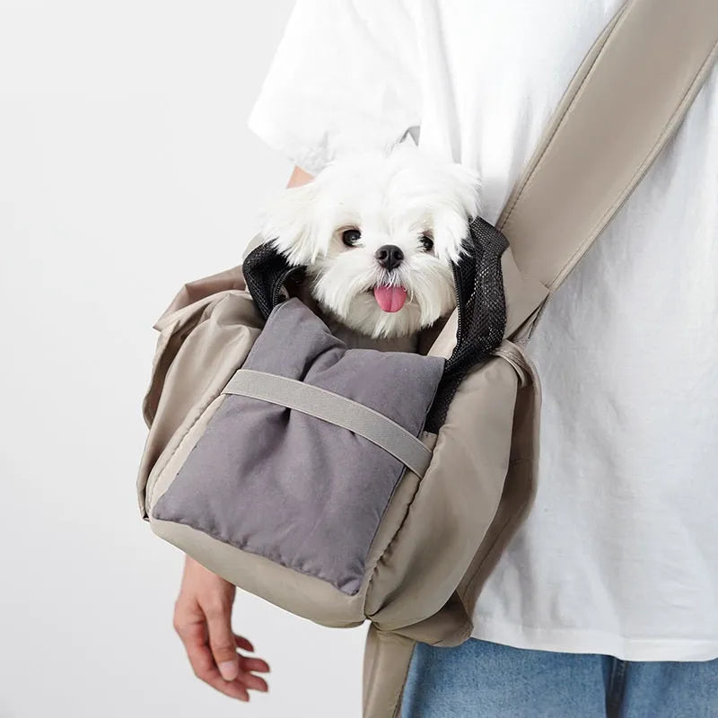 Apricot coloured cloth pet carrier handbag showing portable size.