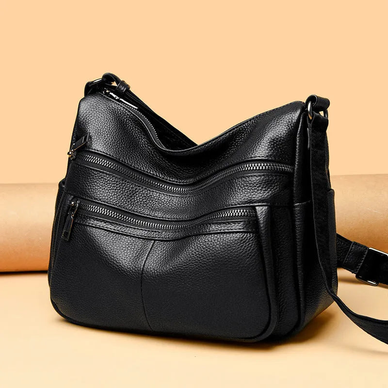 First layer cowhide genuine leather pillow-shaped shoulder messenger bag in black, small size