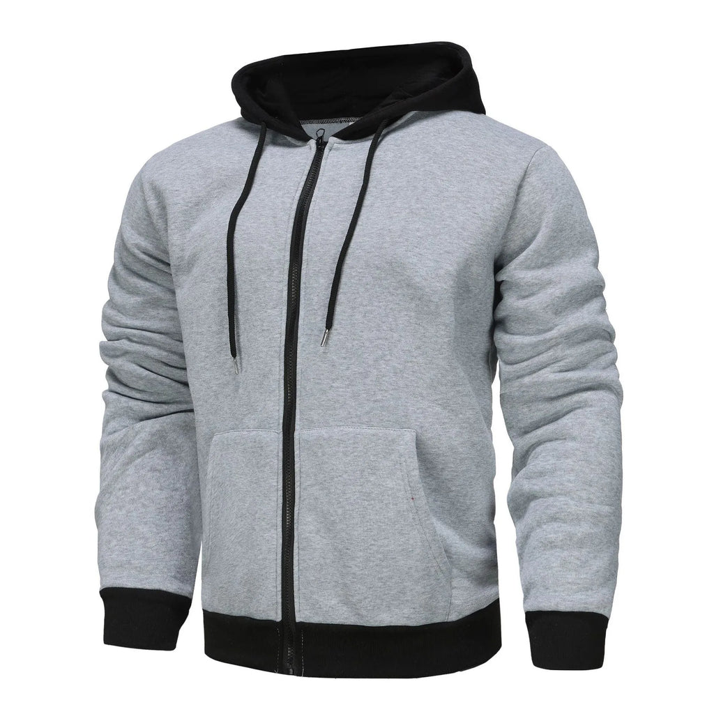 Man wearing a black zip-up hooded cardigan with a contrasting grey hood and wool lining.