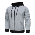 Man wearing a black zip-up hooded cardigan with a contrasting grey hood and wool lining.