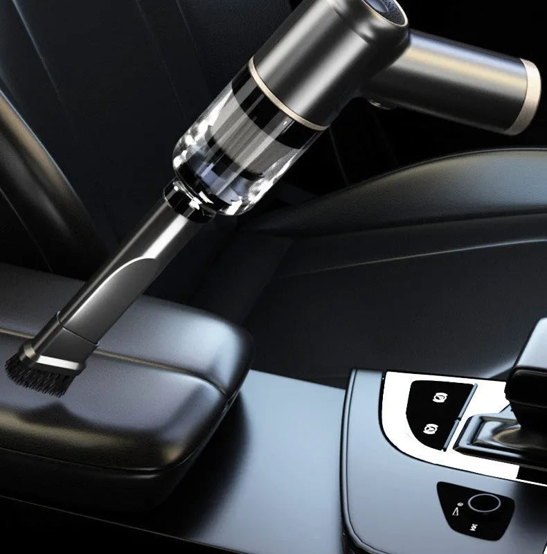 Black wireless handheld car vacuum cleaner and inflator with multiple nozzle attachments