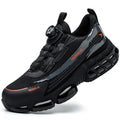 Lightweight black work safety shoes with a steel toe cap, Flyknit upper, and front laces on a grey background.