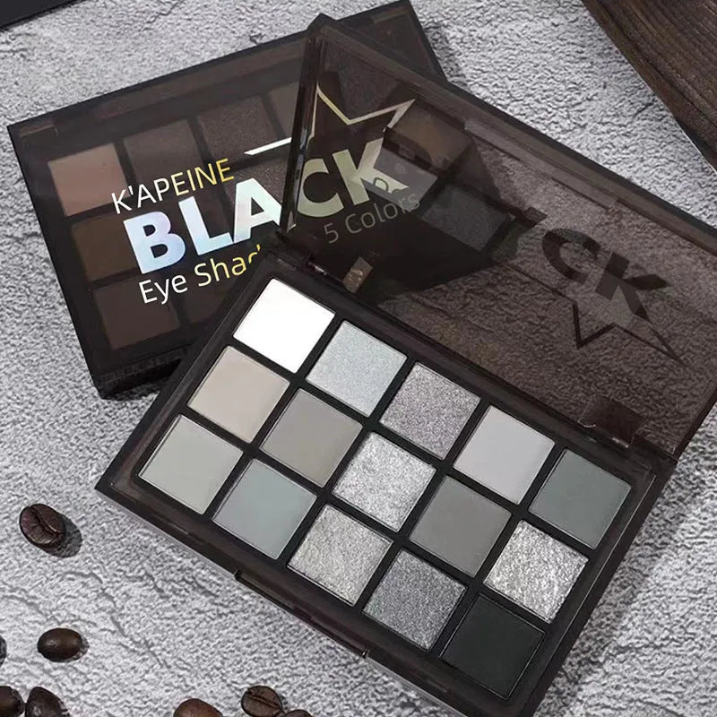 15-colour Night Elf eye shadow palette showing grey, black, and dark matte shimmer shades.
