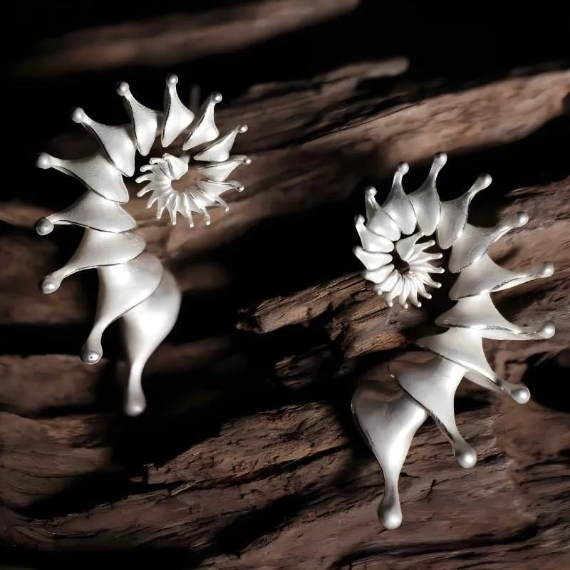 Exaggerated three-dimensional conch stud earrings with matte electroplated alloy finish