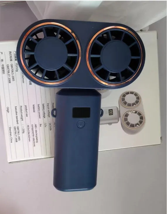 Dark blue foldable USB rechargeable handheld mini fan showing digital display screen and five blades.