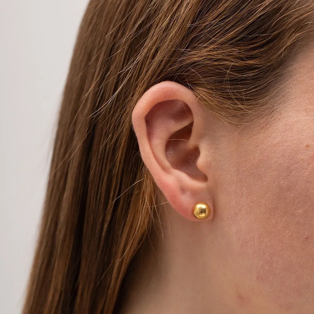 Stainless steel ball stud earrings in gold or silver finish, showing 3mm, 4mm, 5mm, and 6mm size options.