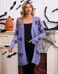 Women's black cardigan with orange pumpkin head jacquard knit pattern on the front.