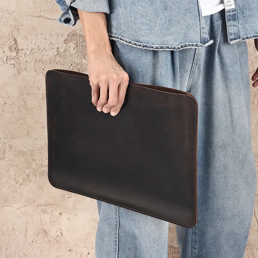 Men's brown crazy horse leather horizontal laptop liner bag showing cowhide construction
