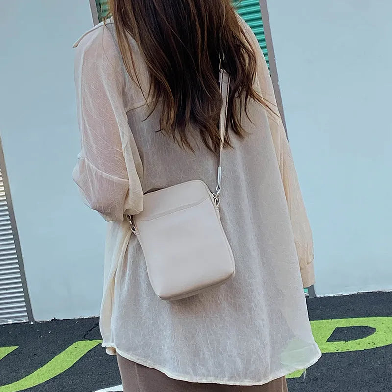 Solid colour PU leather mobile phone crossbody bag measuring 14.5x5.5x19cm