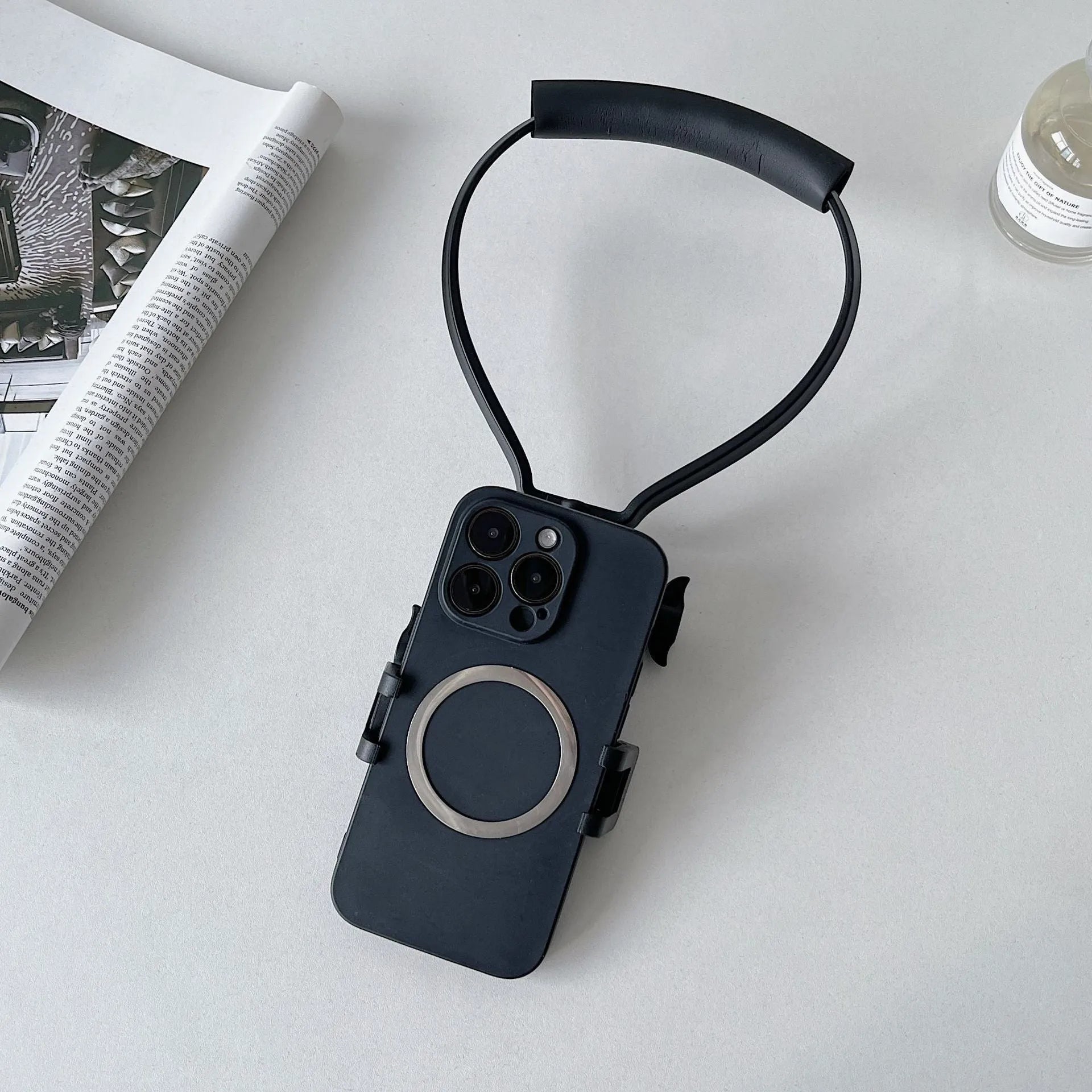 Universal plastic cell phone neck hanging bracket in black with horizontal and vertical clip, extension, and anti-slip cushion