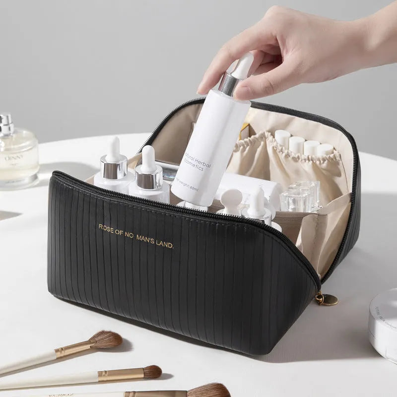 Vertical pattern pillow makeup bag in PU leather with cubic 22.5cm dimensions for travel storage