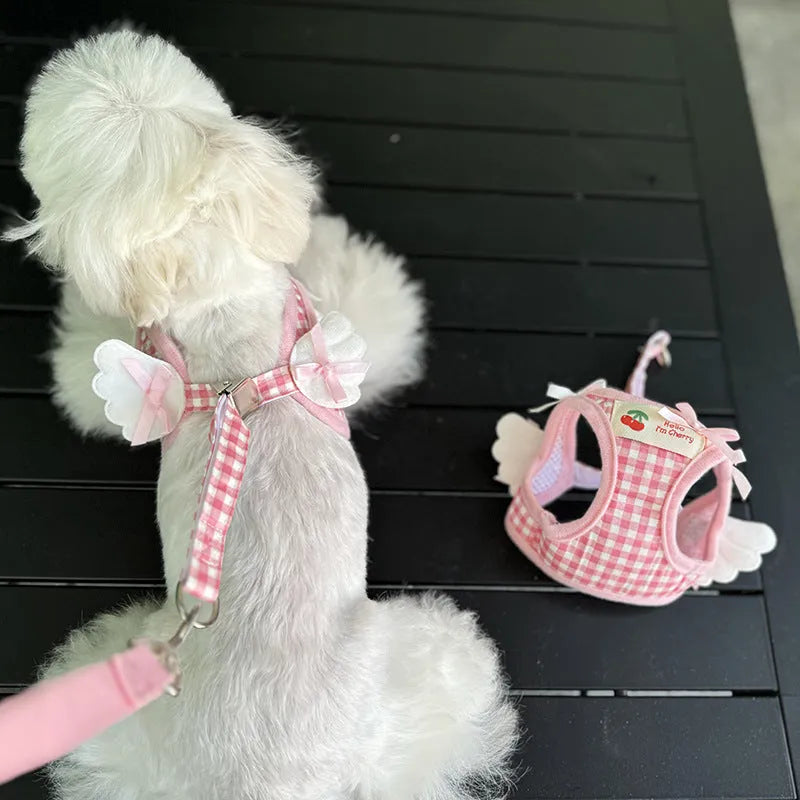 Pink cotton chest and back harness lead for a small dog on a white background.